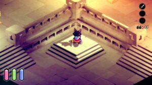 a small fox with dark purple fur, a pink tunic, and a light blue nose stands on a pedestal in a room made of sand colored stone.