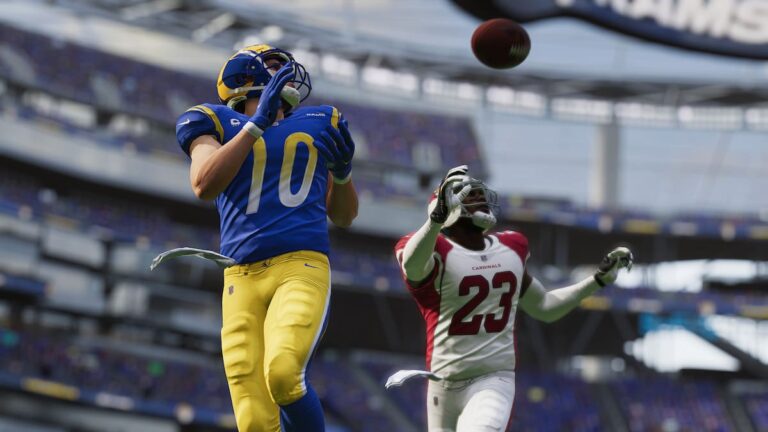 Player trying to catch a throw in Madden 23