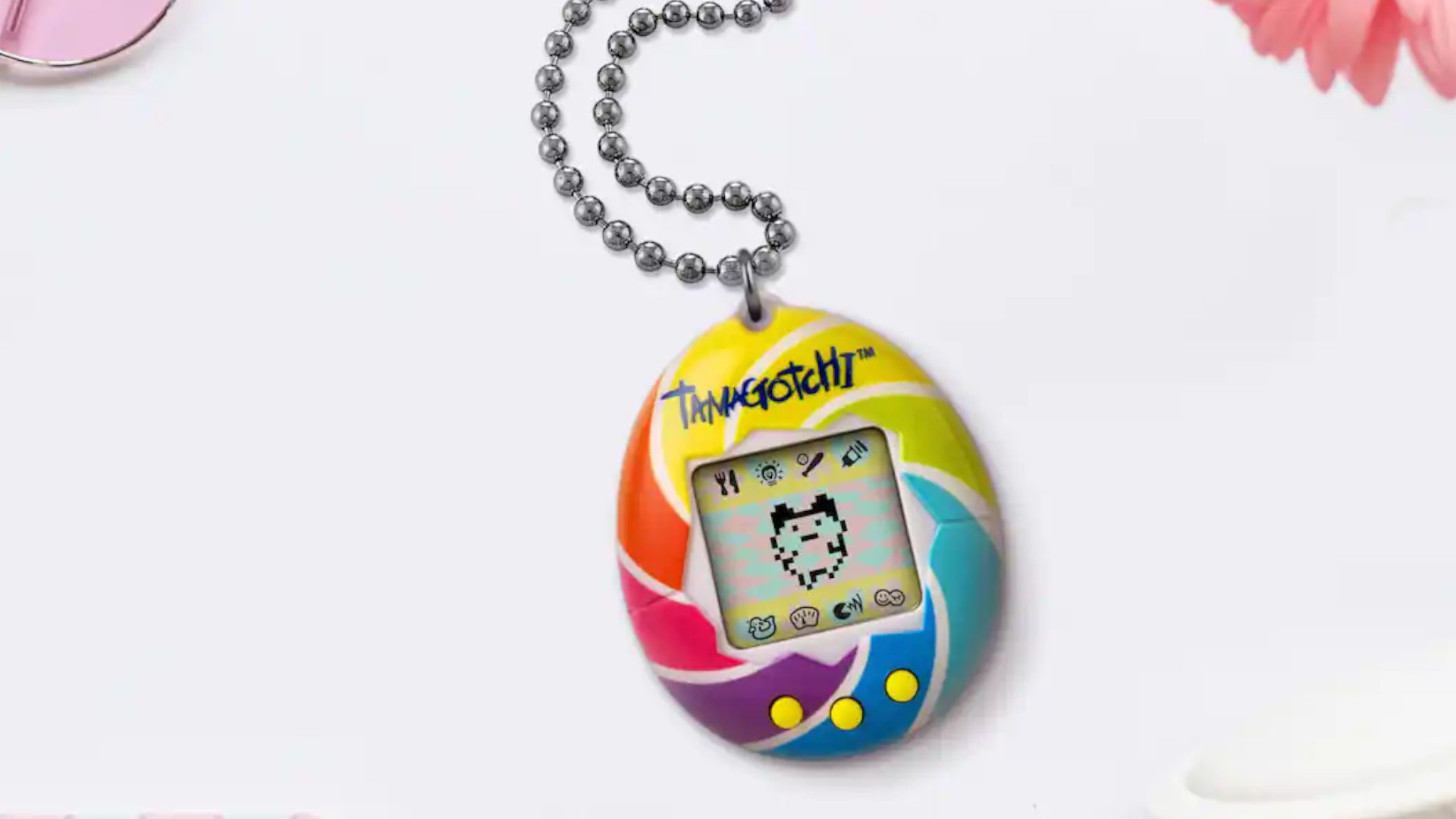 Arte promocional de um redemoinho colorido Tamagotchi original