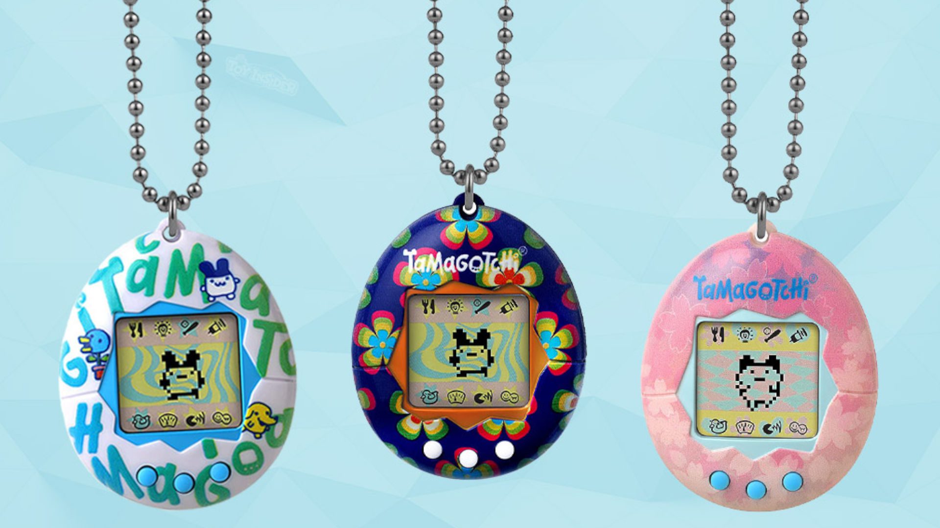 Arte promocional de outro trio de Tamagotchis originais, mas em um fundo azul