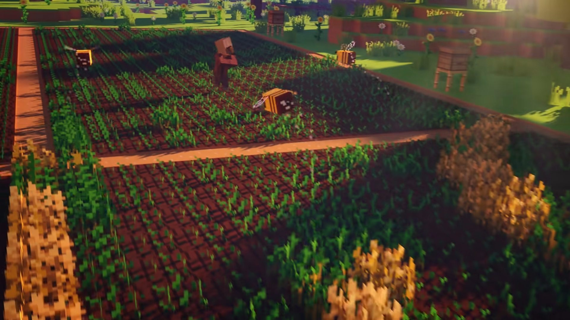 melhores jogos de fazenda-minecraft Melhores jogos de fazenda - Minecraft. Uma captura de tela mostra um trecho de terra agrícola com abelhas voando e moradores parados no meio dela.