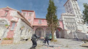 Two counter-terrorist operatives about to run past a tree in Italy