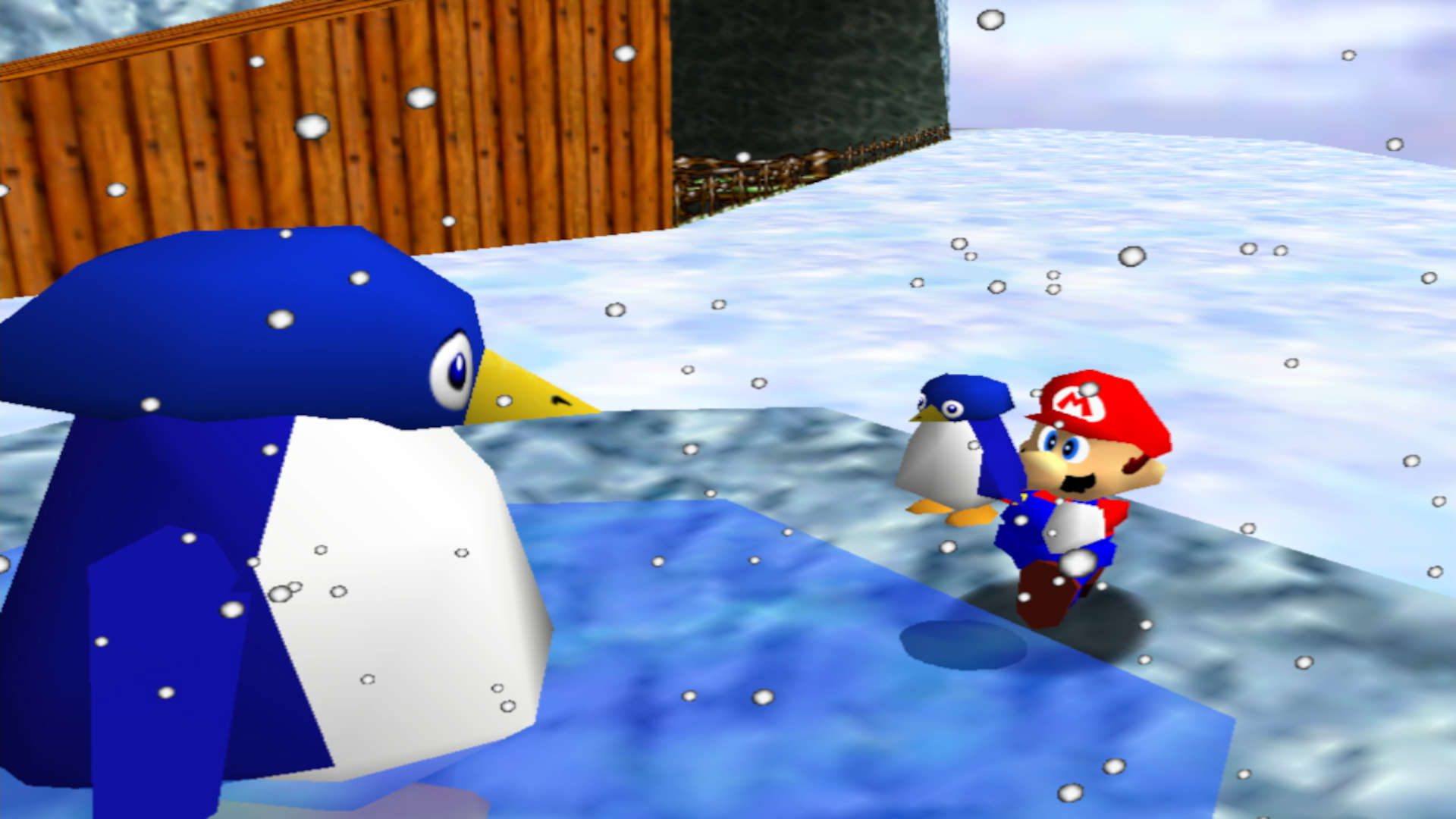 jogos de natal-1 Jogos de Natal - Mario segurando um pequeno pinguim em direção a um pinguim com o dobro do seu tamanho